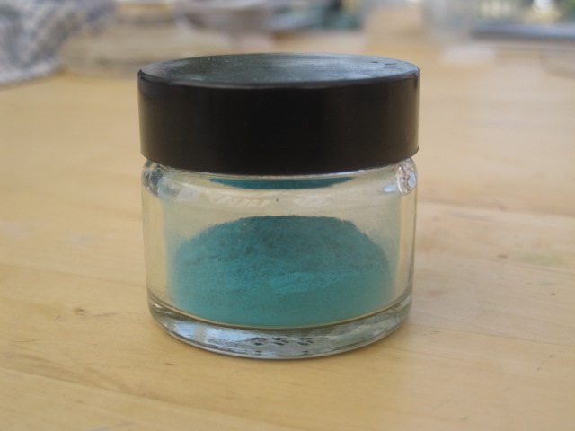 Verdigris pigment in a jar after three weeks